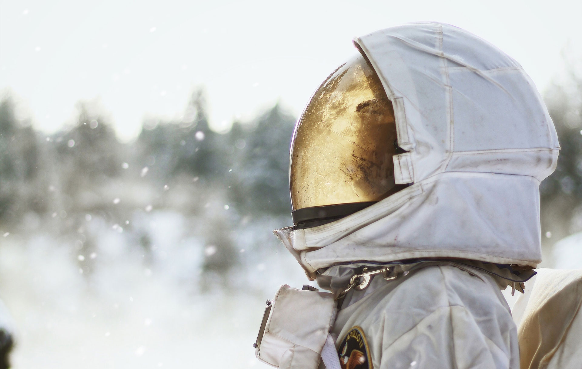 A white spacesuit with gold visor