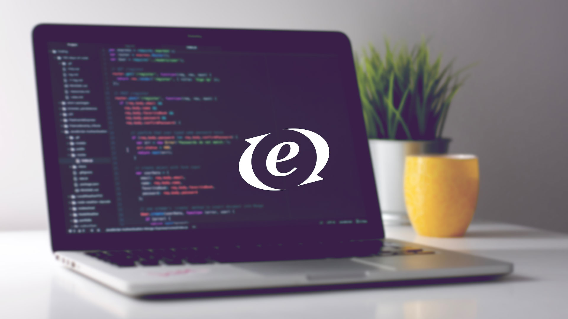 ExpressionEngine logo on a MacBook