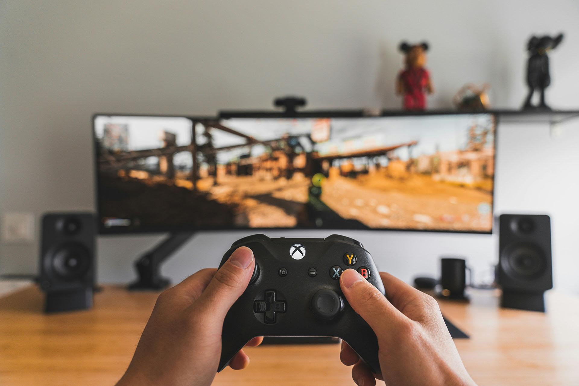 Person playing on an Xbox controller