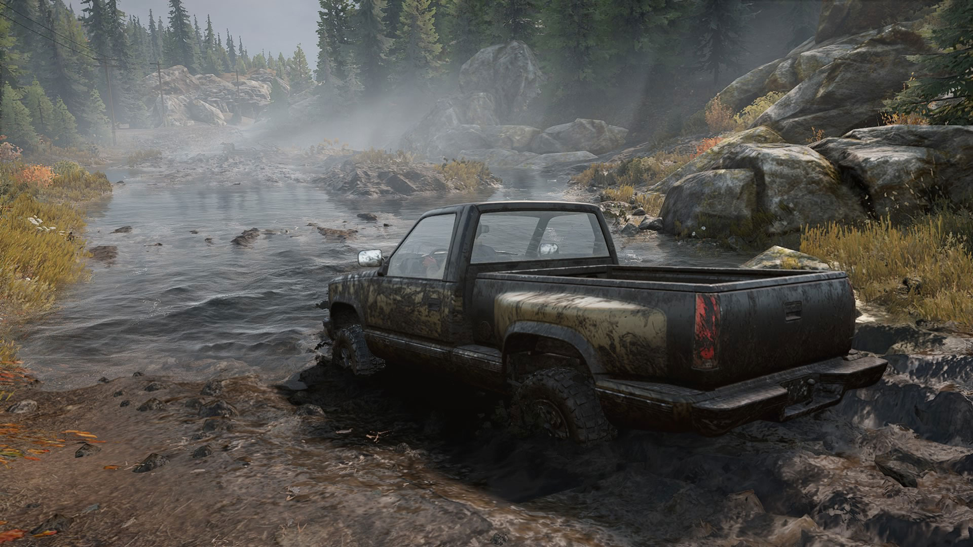 A jeep driving through thick mud