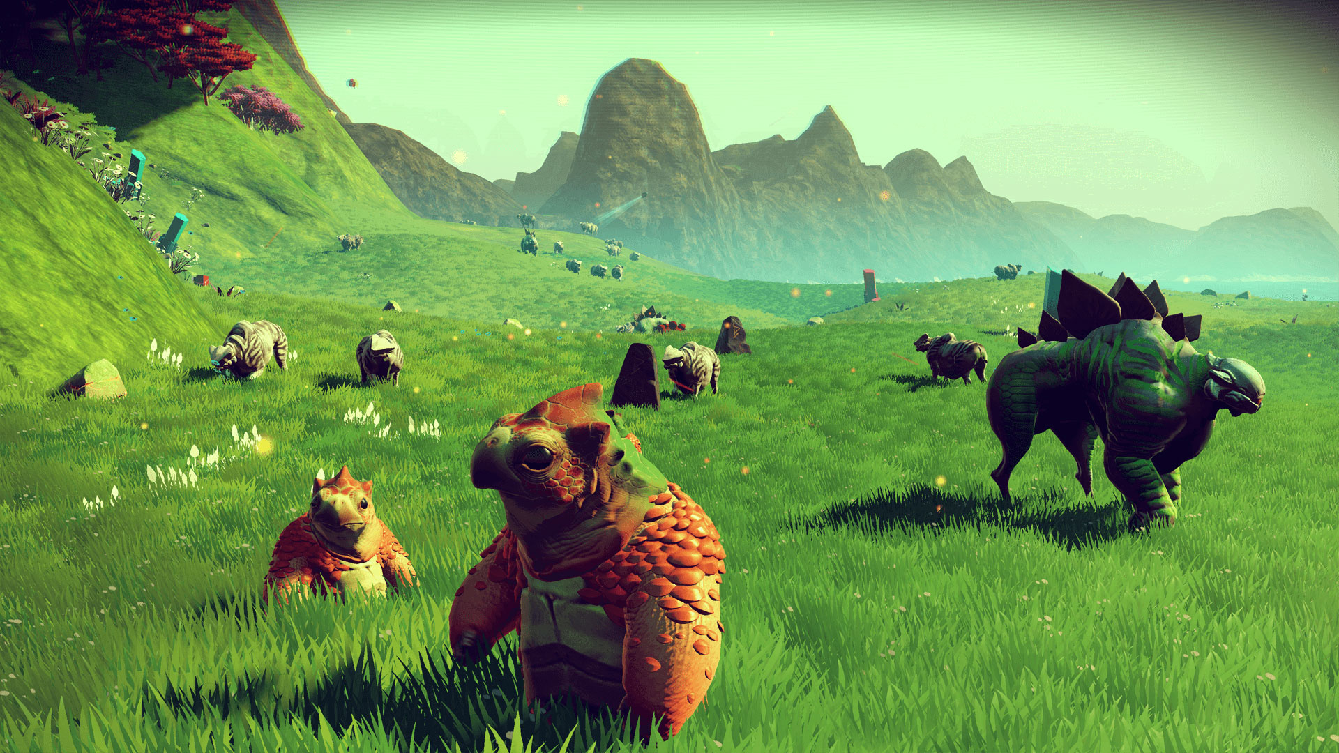 Aliens from No Man's Sky in a grassy field