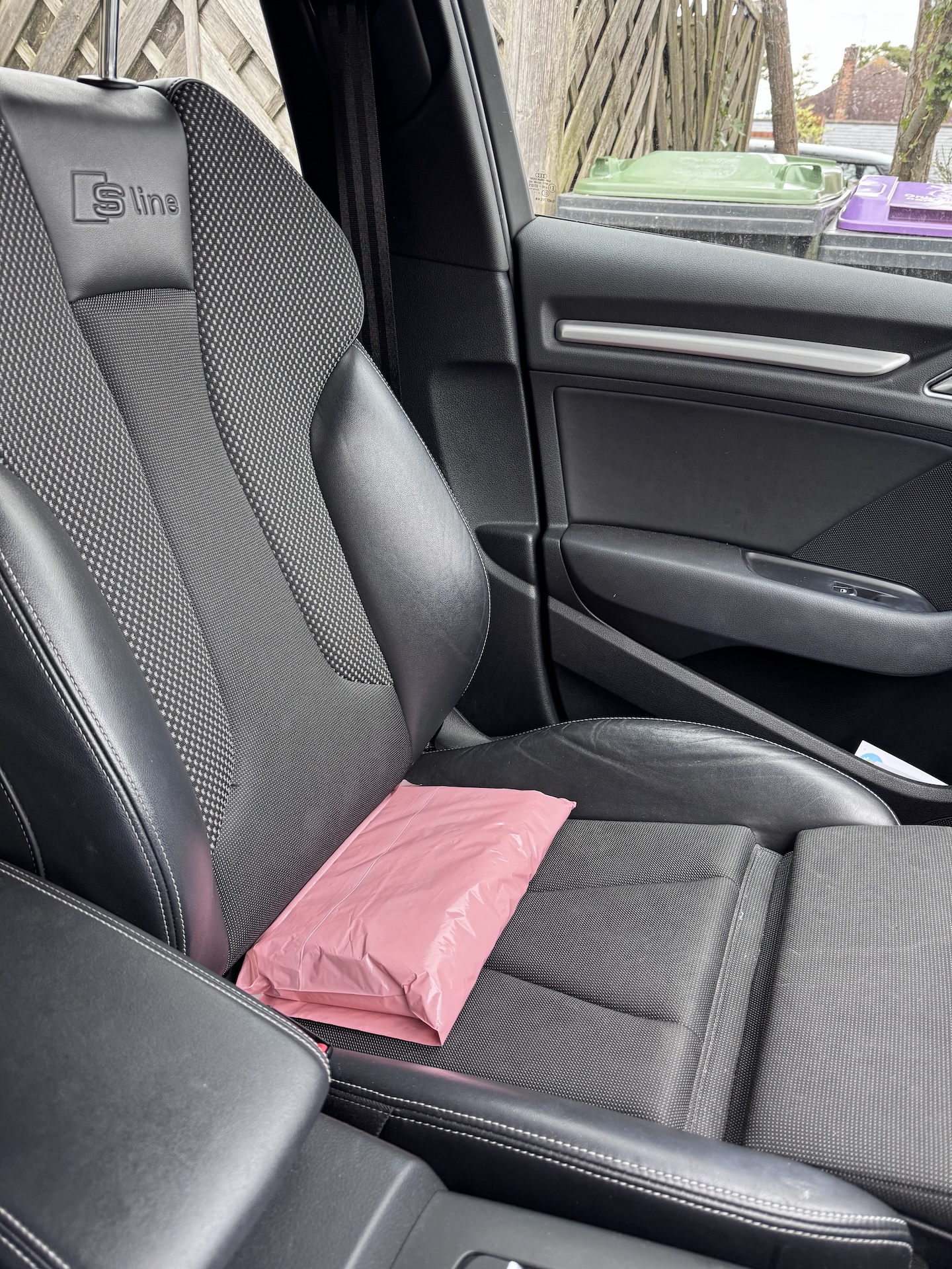 A pink parcel on my car seat