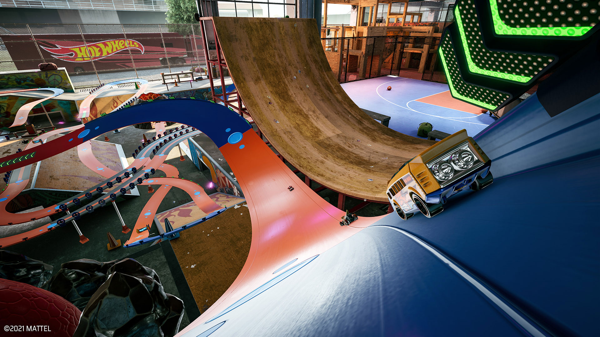 Hot Wheels cars racing through a skate park