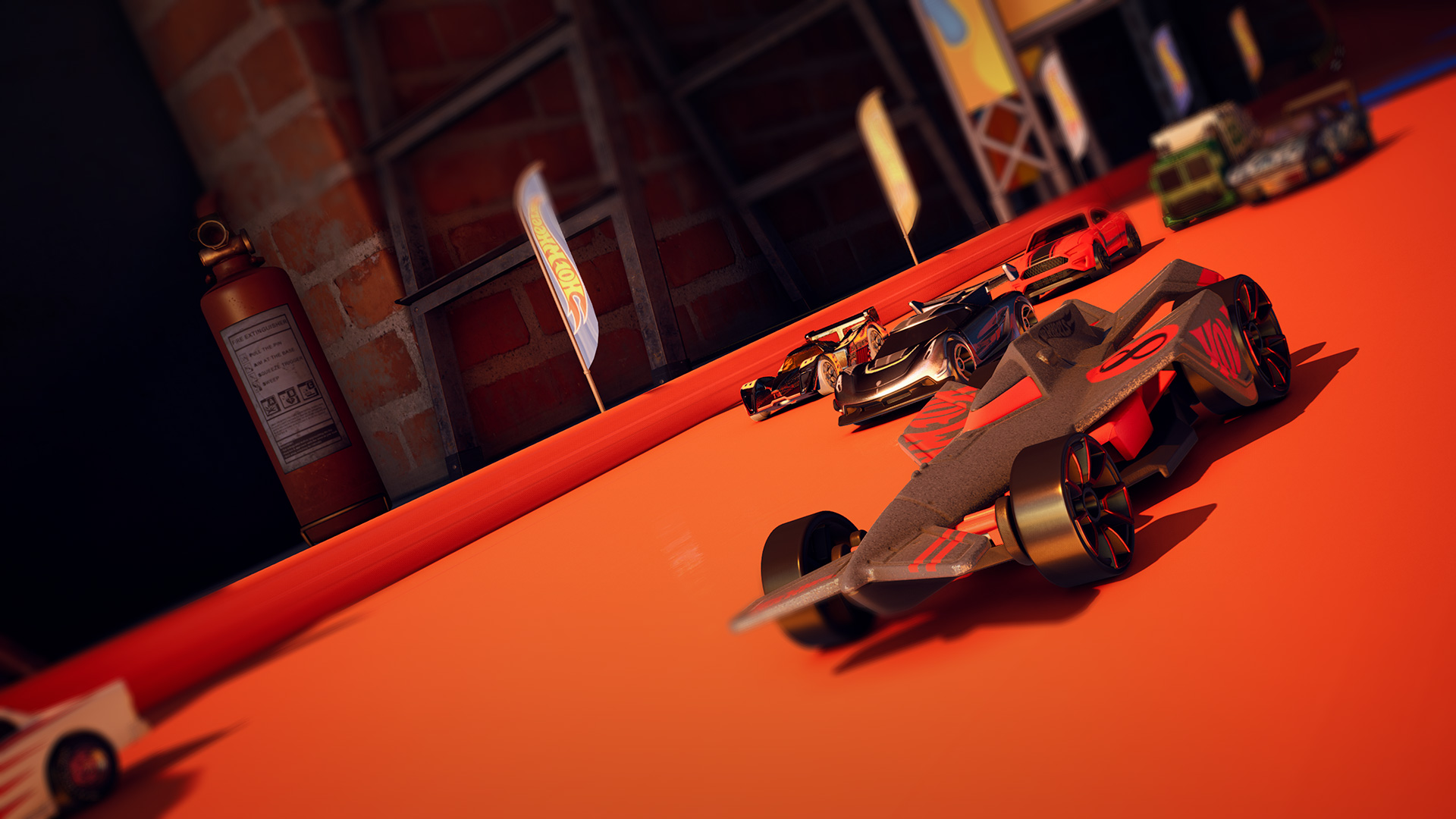 Hot Wheels race cars on orange track