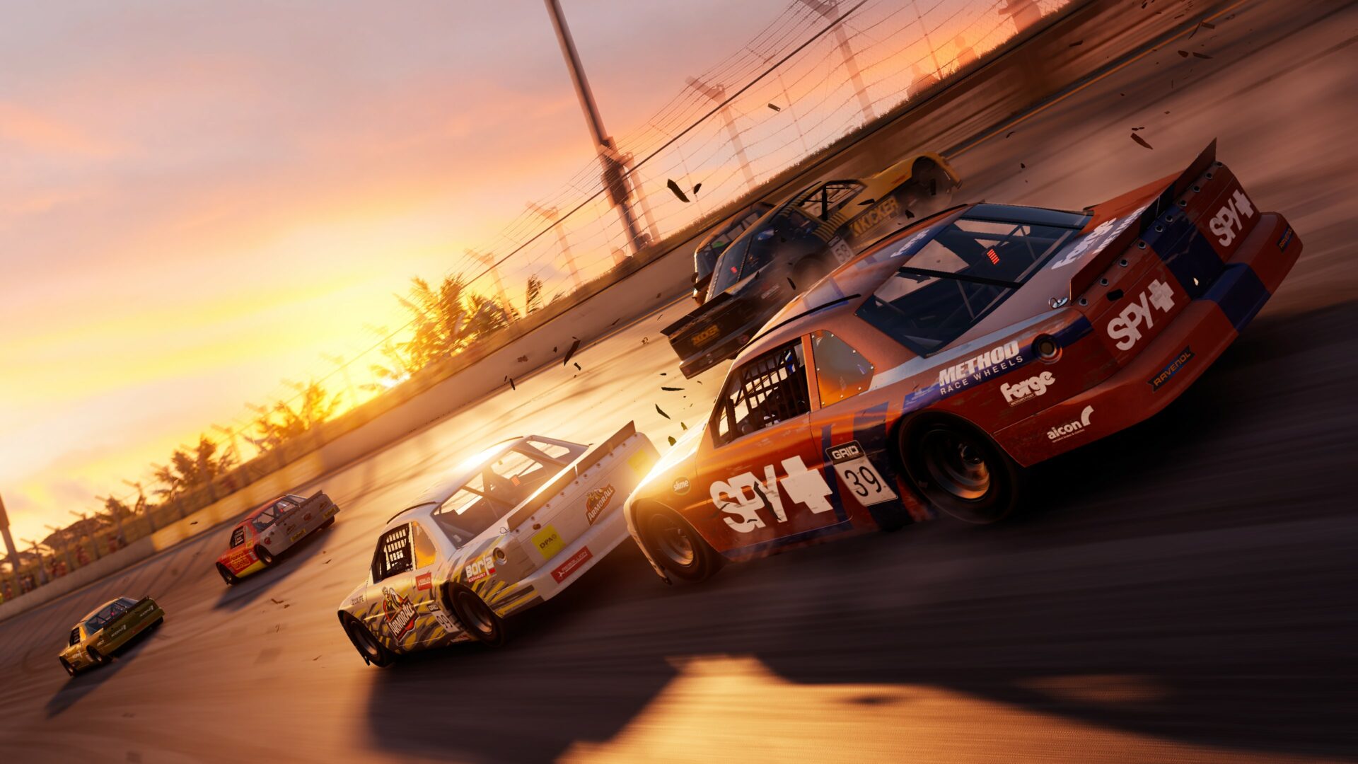 Cars racing on oval nascar track